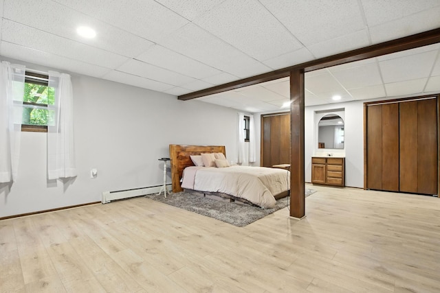 40474 N Glendale Ave, Beach Park, IL 60099 - bedroom with baseboard heating, light wood finished floors, a paneled ceiling, and recessed lighting