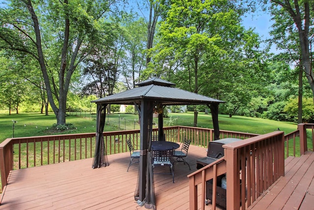40474 N Glendale Ave, Beach Park, IL 60099 - deck with outdoor dining space, a gazebo, a lawn, and view of scattered trees
