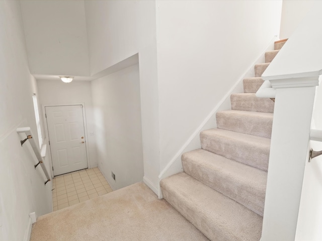 775 N Regis Ct, Palatine, IL 60067 - carpeted foyer with stairway, a towering ceiling, and tile patterned flooring