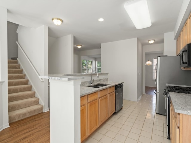 775 N Regis Ct, Palatine, IL 60067 - kitchen with appliances with stainless steel finishes, a kitchen island with sink, recessed lighting, light tile patterned flooring, and light stone countertops
