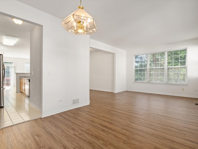 775 N Regis Ct, Palatine, IL 60067 - spare room with a chandelier and wood finished floors