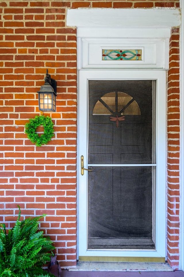 314 Elk St, Galena, IL 61036 - doorway to property featuring brick siding