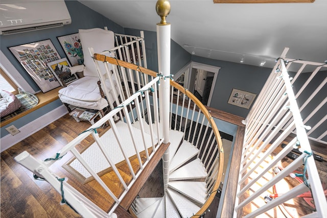 314 Elk St, Galena, IL 61036 - stairway with a wall unit AC and wood finished floors