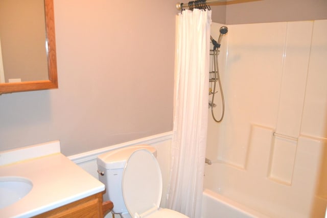 707 Omaha Ave, Lincoln, IL 62656 - full bath with vanity, shower / bath combo with shower curtain, and a wainscoted wall