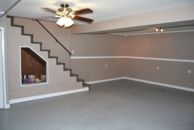 707 Omaha Ave, Lincoln, IL 62656 - below grade area featuring stairs and a ceiling fan