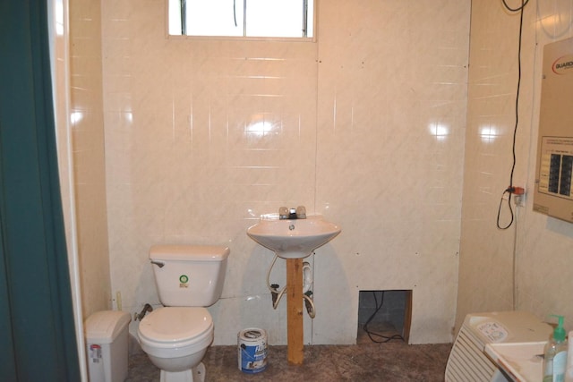 707 Omaha Ave, Lincoln, IL 62656 - bathroom with tile walls and toilet