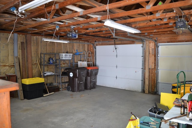 707 Omaha Ave, Lincoln, IL 62656 - garage featuring a garage door opener