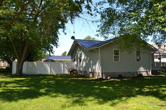 707 Omaha Ave, Lincoln, IL 62656 - view of home's exterior with crawl space and a metal roof