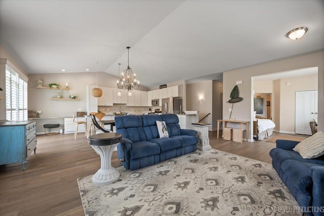 1126 Mandalay Ln Unit 1126, Bolingbrook, IL 60490 - living area with vaulted ceiling, wood finished floors, and a chandelier