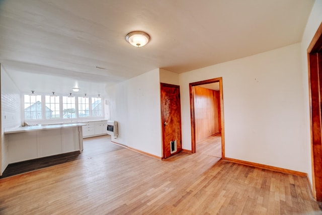 2371 N 3100 E Rd, Donovan, IL 60931 - spare room with heating unit and light wood-style flooring