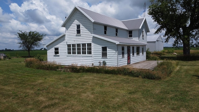2371 N 3100 E Rd, Donovan, IL 60931 - view of property exterior featuring a lawn and a metal roof