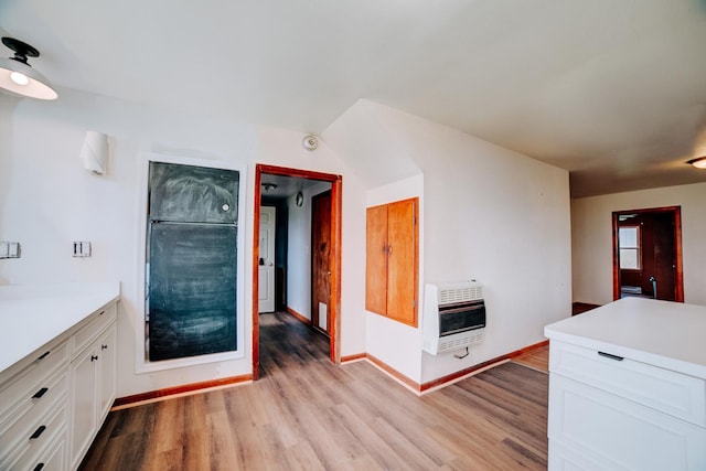 2371 N 3100 E Rd, Donovan, IL 60931 - bathroom with heating unit, wood finished floors, and vanity
