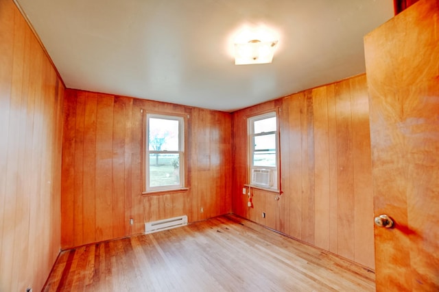 2371 N 3100 E Rd, Donovan, IL 60931 - spare room with a baseboard radiator, wood finished floors, wooden walls, and cooling unit