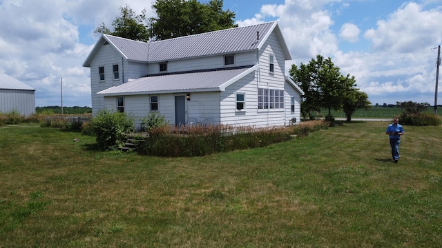 2371 N 3100 E Rd, Donovan, IL 60931 - rear view of property with a yard and a metal roof