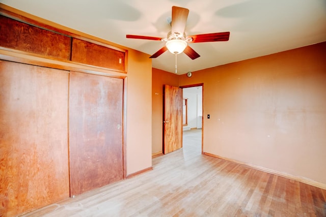 2371 N 3100 E Rd, Donovan, IL 60931 - unfurnished bedroom featuring wood finished floors, a closet, and a ceiling fan