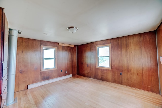 2371 N 3100 E Rd, Donovan, IL 60931 - spare room featuring baseboard heating, healthy amount of natural light, light wood-style floors, and wooden walls
