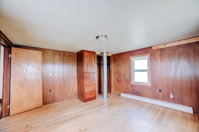 2371 N 3100 E Rd, Donovan, IL 60931 - spare room with baseboard heating, wood finished floors, and wood walls
