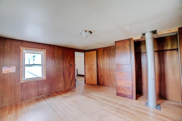 2371 N 3100 E Rd, Donovan, IL 60931 - unfurnished bedroom with light wood-type flooring and wooden walls
