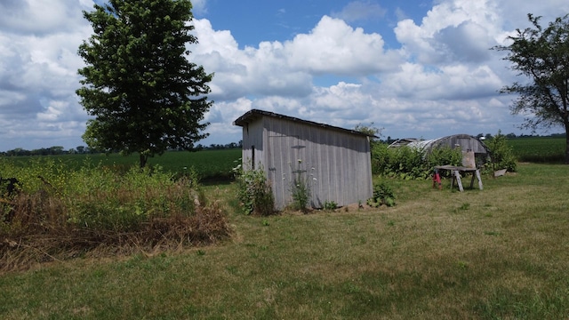 2371 N 3100 E Rd, Donovan, IL 60931 - view of grassy yard featuring a storage unit and a rural view