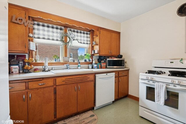 10536 S Artesian Ave, Chicago, IL 60655 - kitchen with white appliances, brown cabinetry, light countertops, open shelves, and light floors