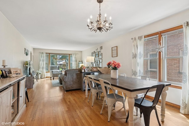 10536 S Artesian Ave, Chicago, IL 60655 - dining area with light wood-style floors and a chandelier