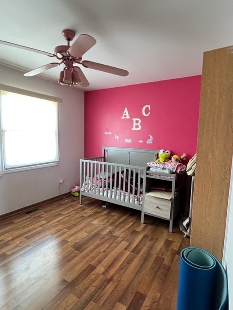 4525 Jefferson Dr, Richton Park, IL 60471 - bedroom with wood finished floors, a nursery area, and a ceiling fan