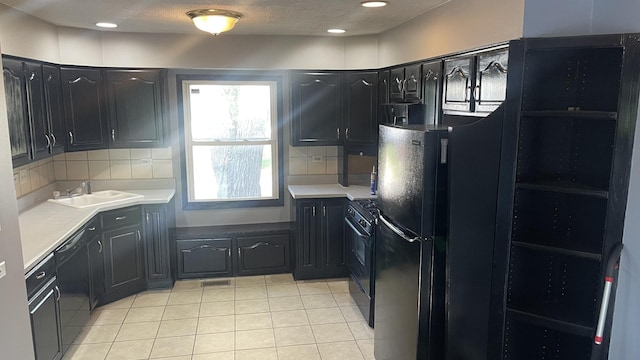 8027 Northway Dr, Hanover Park, IL 60133 - kitchen featuring black appliances, light tile patterned flooring, decorative backsplash, light countertops, and recessed lighting