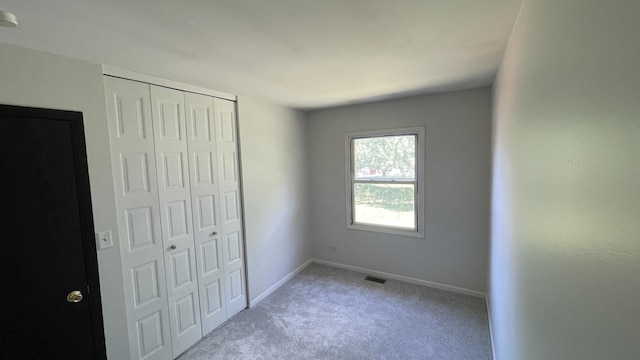 8027 Northway Dr, Hanover Park, IL 60133 - unfurnished bedroom featuring a closet and carpet