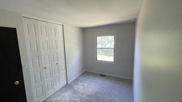 8027 Northway Dr, Hanover Park, IL 60133 - unfurnished bedroom featuring carpet and a closet