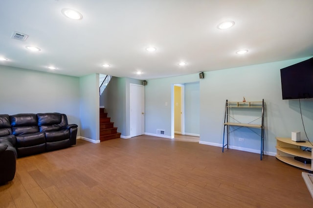 1150 Attleboro Ct, Schaumburg, IL 60193 - living area with wood finished floors, stairway, and recessed lighting