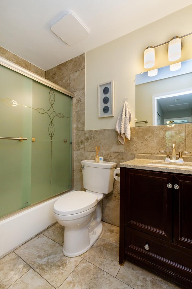 1150 Attleboro Ct, Schaumburg, IL 60193 - full bathroom featuring tile walls, vanity, tile patterned flooring, and shower / bath combination with glass door