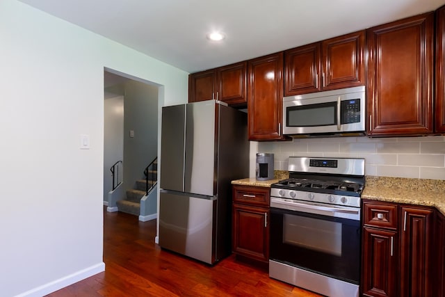 1150 Attleboro Ct, Schaumburg, IL 60193 - kitchen with stainless steel appliances, dark brown cabinets, dark wood-style floors, tasteful backsplash, and recessed lighting