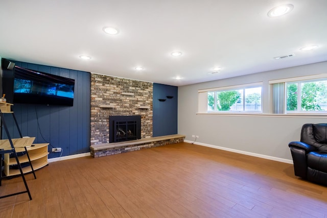 1150 Attleboro Ct, Schaumburg, IL 60193 - living room with wood finished floors, a brick fireplace, and recessed lighting