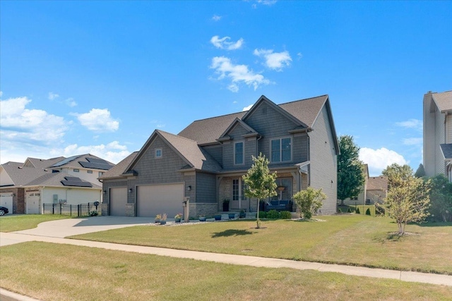 1504 Jacobs Blvd, Champaign, IL 61822 - craftsman house featuring concrete driveway, stone siding, and an attached garage