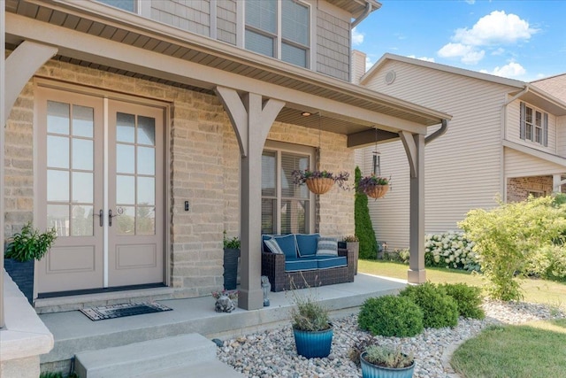 1504 Jacobs Blvd, Champaign, IL 61822 - view of exterior entry featuring a porch, brick siding, and french doors