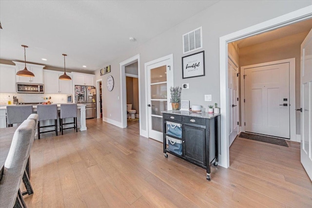 1504 Jacobs Blvd, Champaign, IL 61822 - interior space with light wood-style flooring, recessed lighting, and french doors