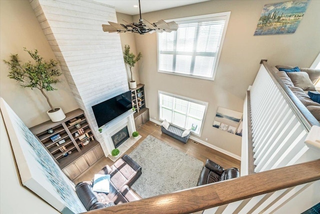 1504 Jacobs Blvd, Champaign, IL 61822 - living area with wood finished floors, a chandelier, a fireplace, and recessed lighting