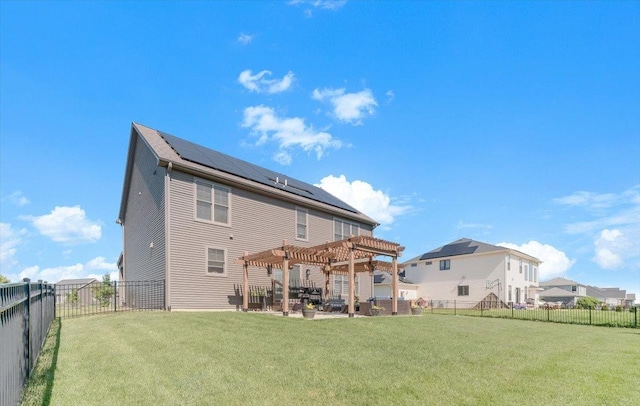 1504 Jacobs Blvd, Champaign, IL 61822 - back of house with a pergola, roof mounted solar panels, a fenced backyard, and a patio