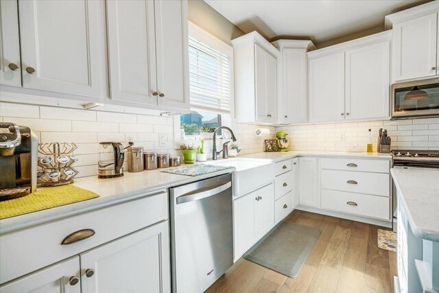 1504 Jacobs Blvd, Champaign, IL 61822 - kitchen featuring appliances with stainless steel finishes, white cabinets, decorative backsplash, and dark wood-style flooring