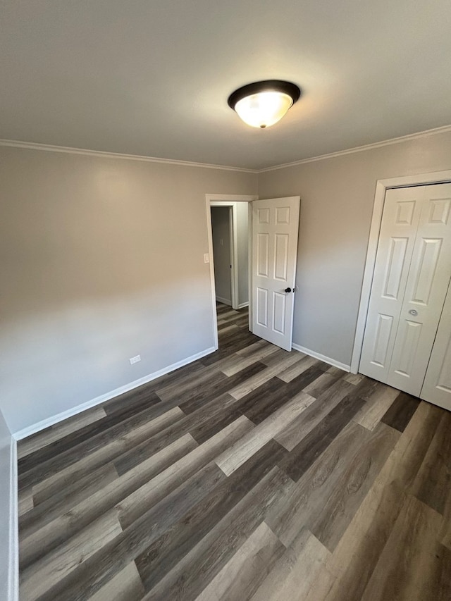14248 Avalon Ave, Dolton, IL 60419 - unfurnished bedroom with dark wood-style floors and crown molding