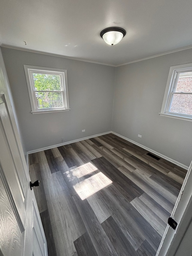 14248 Avalon Ave, Dolton, IL 60419 - empty room featuring crown molding and dark wood-style flooring