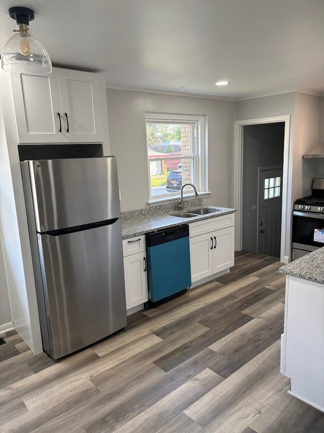 14248 Avalon Ave, Dolton, IL 60419 - kitchen featuring stainless steel appliances, crown molding, white cabinets, light stone countertops, and wood finished floors