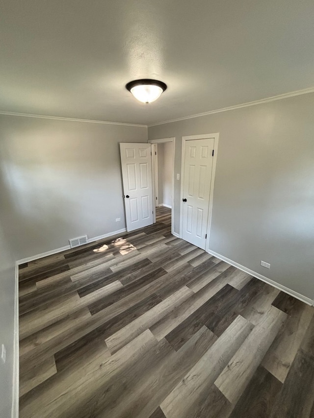 14248 Avalon Ave, Dolton, IL 60419 - spare room with dark wood-type flooring and crown molding