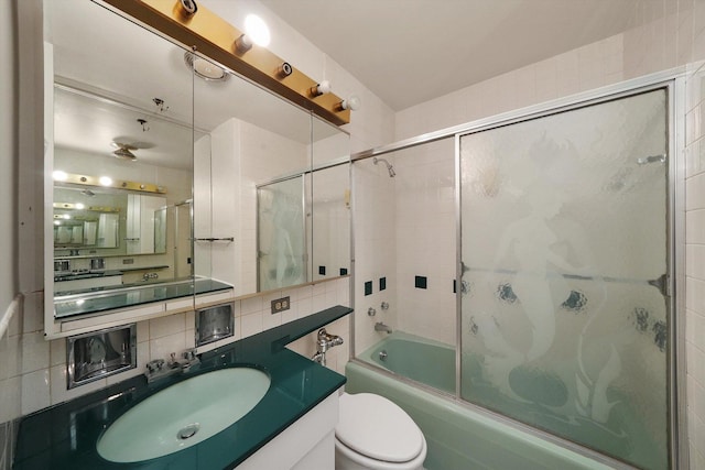 3150 N Lake Shore Dr Unit 14E, Chicago, IL 60657 - full bathroom with decorative backsplash, bath / shower combo with glass door, vanity, and tile walls