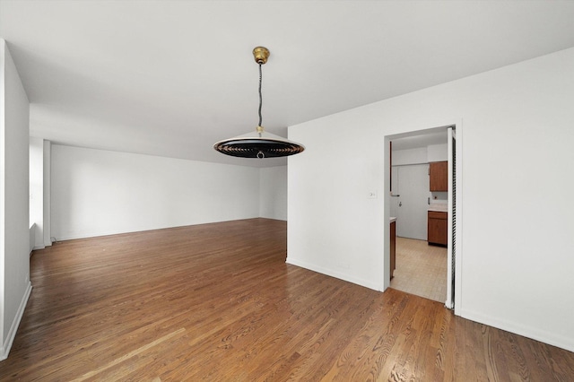 3150 N Lake Shore Dr Unit 14E, Chicago, IL 60657 - spare room featuring wood finished floors and baseboards