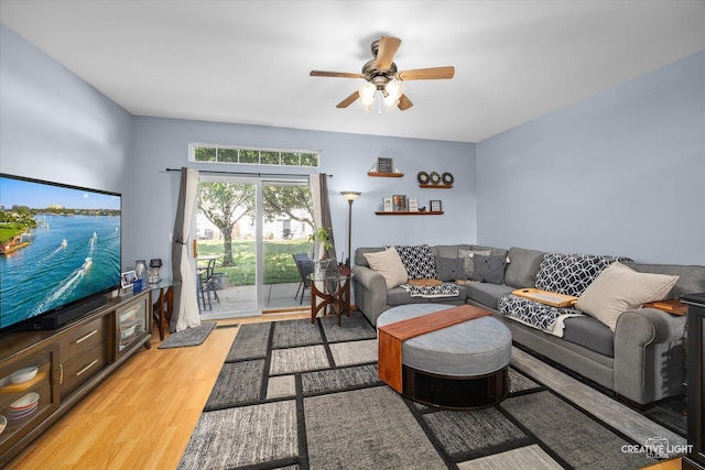 503 Huntington Ct Unit 503, Oswego, IL 60543 - living area featuring light wood finished floors and a ceiling fan
