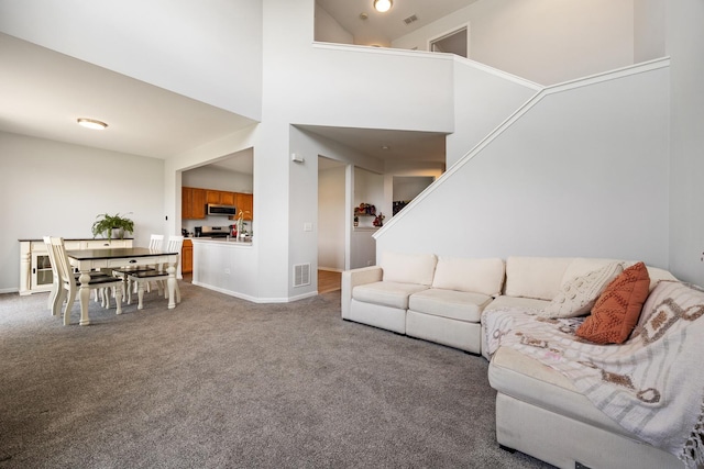 630 Legend Ln, Mchenry, IL 60050 - carpeted living area with a high ceiling and stairs