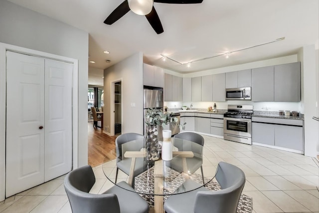 1636 N Leavitt St, Chicago, IL 60647 - dining room featuring a ceiling fan, light tile patterned floors, and track lighting