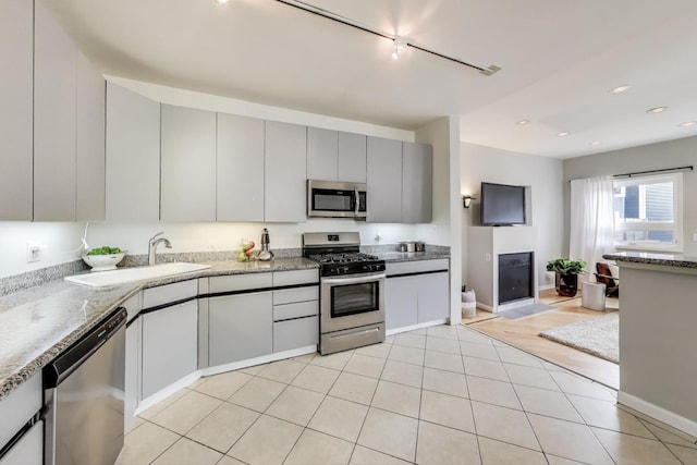 1636 N Leavitt St, Chicago, IL 60647 - kitchen with stainless steel appliances, gray cabinets, track lighting, and recessed lighting