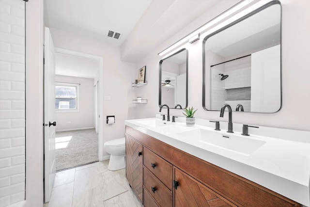 10417 Massasoit Ave, Oak Lawn, IL 60453 - full bathroom with double vanity, marble look tile flooring, a ceiling fan, and a shower
